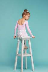 Image showing The little balerina dancer on blue background