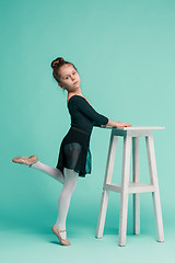 Image showing The little balerina dancer on blue background