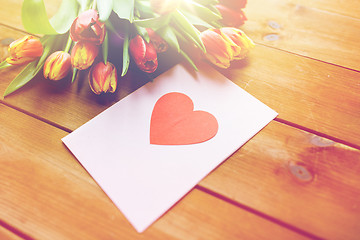 Image showing close up of flowers and greeting card with heart