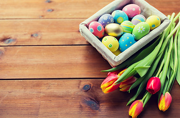 Image showing close up of colored easter eggs and flowers