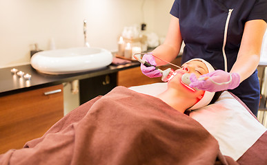 Image showing young woman having face microdermabrasion at spa