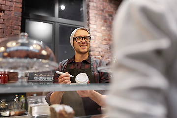 Image showing man or barman with coffee cup and customer at cafe