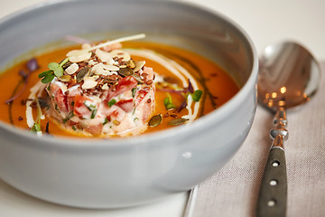 Image showing close up of vegetable pumpkin-ginger soup in bowl