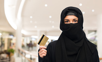 Image showing muslim woman in hijab with credit card over white