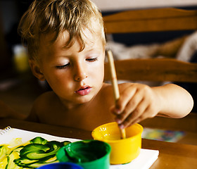 Image showing little cute boy painting at home, lifestyle people concept