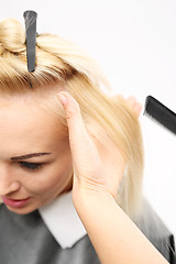 Image showing Hairdressing Hairdresser combing woman