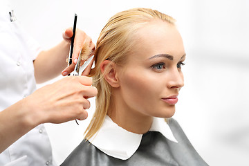 Image showing Barber haircut woman in a hair salon 