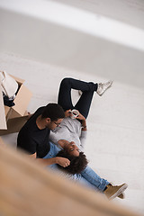 Image showing African American couple relaxing in new house