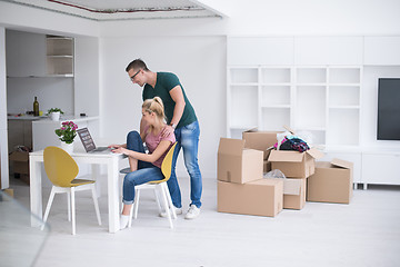 Image showing Young couple moving in a new home