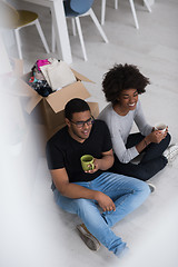 Image showing African American couple relaxing in new house