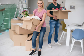 Image showing young couple moving into a new home