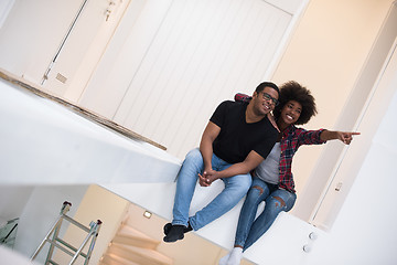 Image showing couple having break during moving to new house