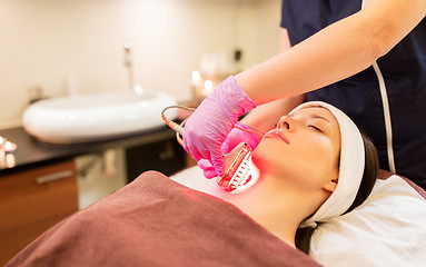 Image showing young woman having face microdermabrasion at spa