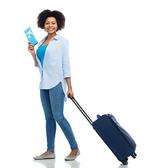 Image showing happy woman with airplane ticket and travel bag