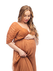 Image showing happy pregnant woman touching her big belly