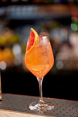 Image showing glass of grapefruit cocktail at bar
