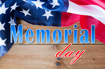 Image showing memorial day words over american flag on wood