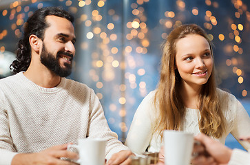 Image showing happy couple meeting and drinking tea or coffee