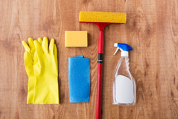 Image showing swab with cleaning stuff on wooden background