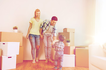 Image showing happy family moving to new home and playing ball