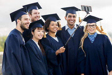 Image showing students or bachelors taking selfie by smartphone