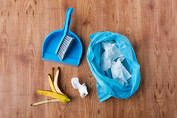 Image showing rubbish bag with trash and cleaning items at home