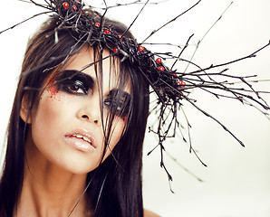 Image showing pretty brunette woman with make up like demon at halloween, isolated on white background closeup