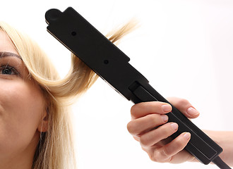 Image showing Straightening. Iron barbershops, hair straightening.