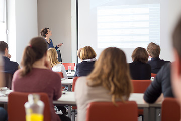 Image showing Woman giving presentation in lecture hall at university.