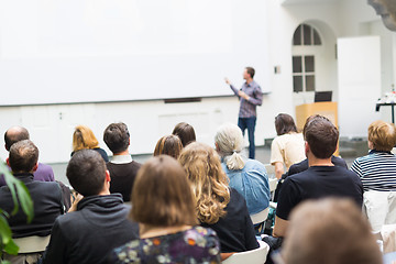 Image showing Man giving presentation in lecture hall at university.