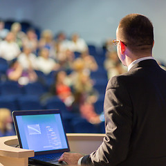 Image showing Public speaker giving talk at business event.