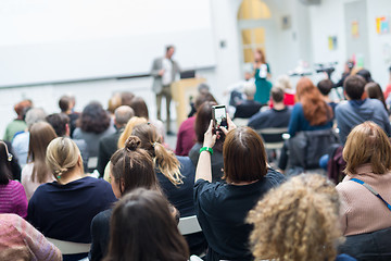 Image showing Man giving presentation in lecture hall at university.