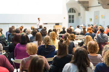 Image showing Woman giving presentation in lecture hall at university.