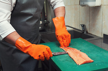 Image showing cutting salmon fish