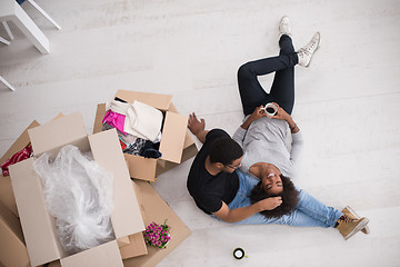 Image showing African American couple relaxing in new house