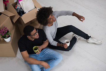 Image showing African American couple relaxing in new house