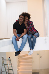 Image showing couple having break during moving to new house