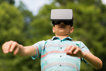 Image showing boy with virtual reality headset outdoors