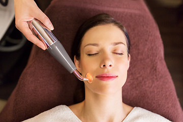 Image showing woman having hydradermie facial treatment in spa