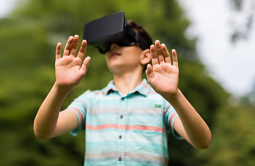 Image showing boy with virtual reality headset outdoors