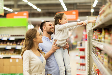 Image showing happy family buying food at grocery store