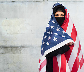 Image showing muslim woman in hijab with american flag