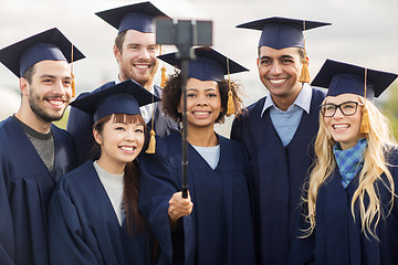 Image showing students or bachelors taking selfie by smartphone