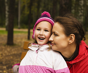 Image showing mature real mother with daughter outside in park, recreation concept, lifestyle people 