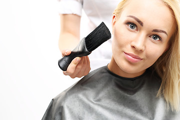 Image showing Brush hairdresser. Barber sweeps  hair with arms client 