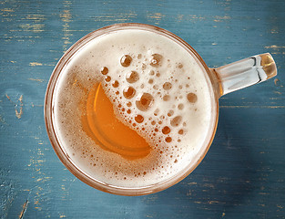 Image showing beer mug on blue wooden table