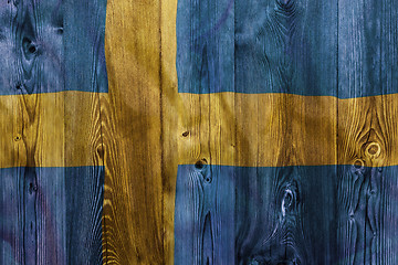 Image showing National flag of Sweden, wooden background