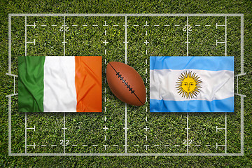 Image showing Ireland vs. Scotland\r\rIreland vs. Argentina flags on green rugby