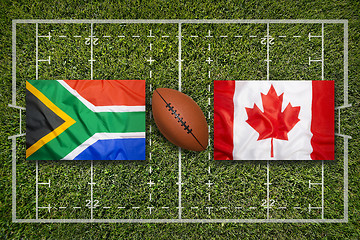 Image showing South Africa vs. Canada flags on rugby field