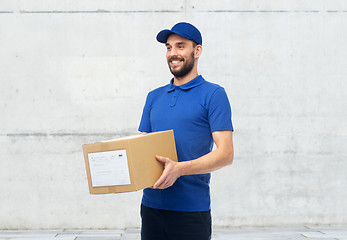 Image showing happy delivery man with parcel box